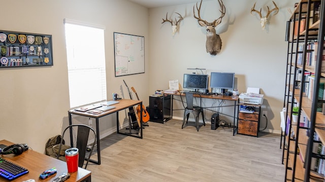 40607 Creekside Bluff Trl, Magnolia, TX 77354 - office with wood finished floors and baseboards
