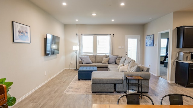 40607 Creekside Bluff Trl, Magnolia, TX 77354 - living room featuring light wood finished floors, recessed lighting, and baseboards
