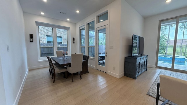 dining room featuring visible vents, recessed lighting, light wood finished floors, and baseboards
