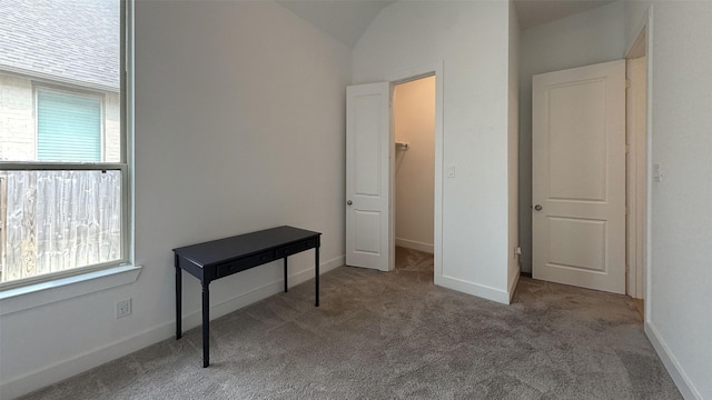 carpeted bedroom featuring vaulted ceiling