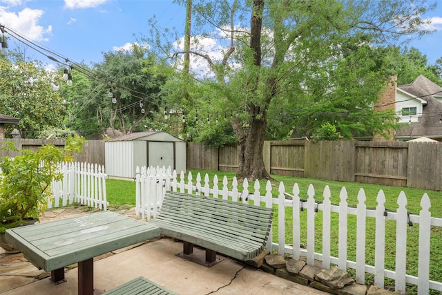 exterior space with a fenced backyard, an outbuilding, and a storage shed