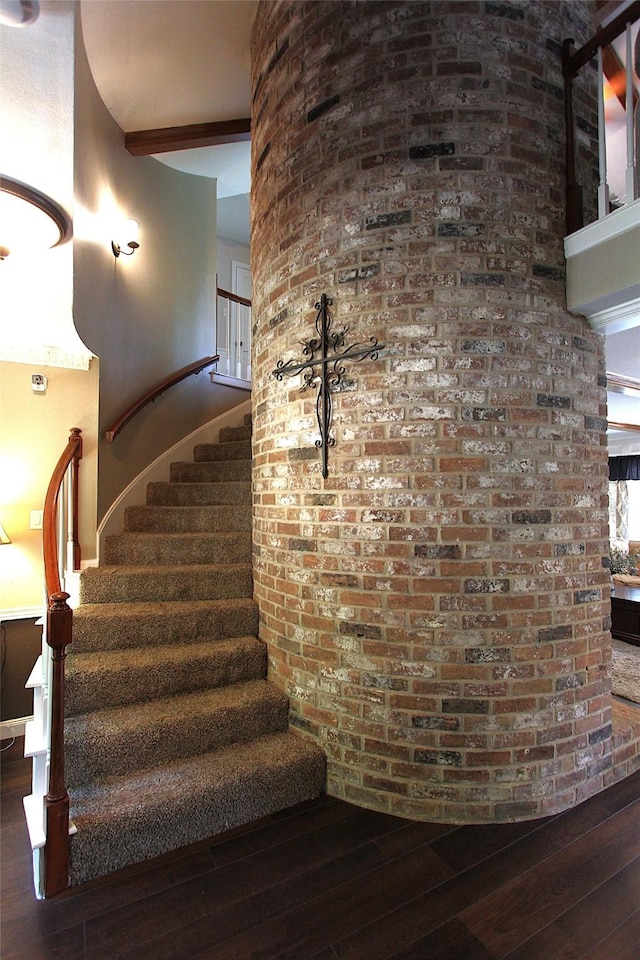 stairway featuring hardwood / wood-style flooring