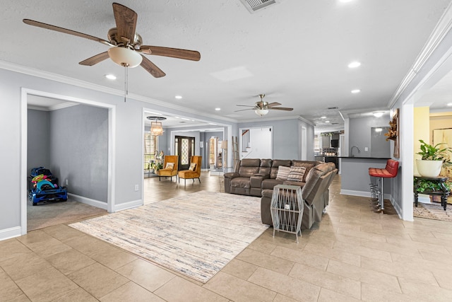 living area featuring light tile patterned flooring, baseboards, visible vents, recessed lighting, and a ceiling fan