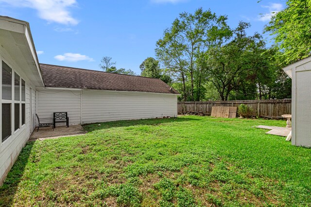 view of yard with a fenced backyard