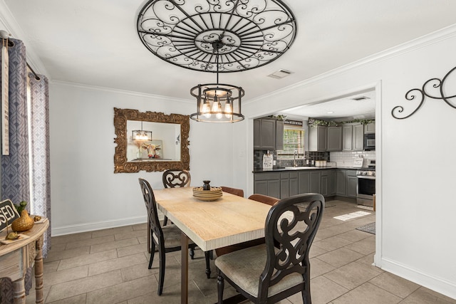 dining area featuring visible vents, ornamental molding, light tile patterned floors, baseboards, and a chandelier