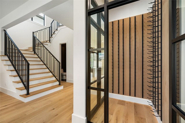 interior space with baseboards and wood finished floors
