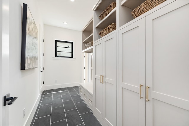 mudroom with baseboards and recessed lighting