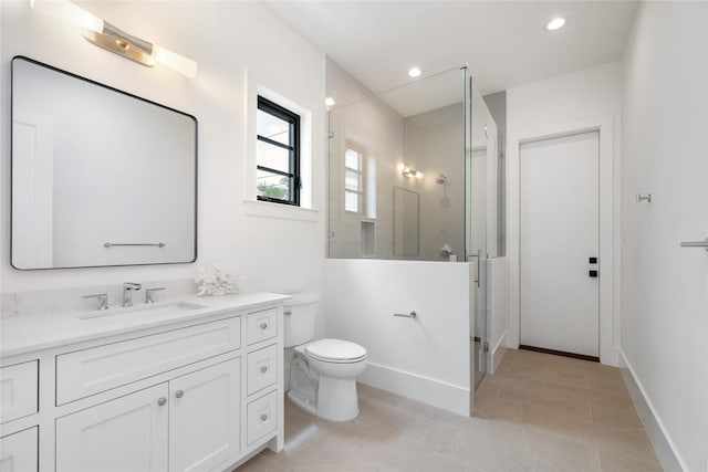 full bathroom featuring recessed lighting, a shower stall, toilet, and vanity