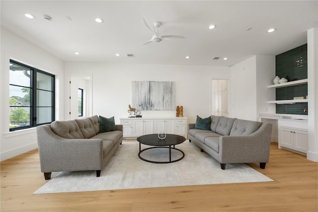 living area with light wood-style flooring, recessed lighting, and ceiling fan