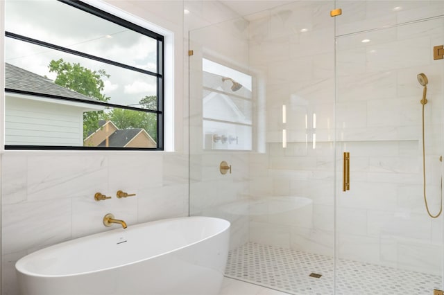 bathroom featuring a freestanding bath and a stall shower