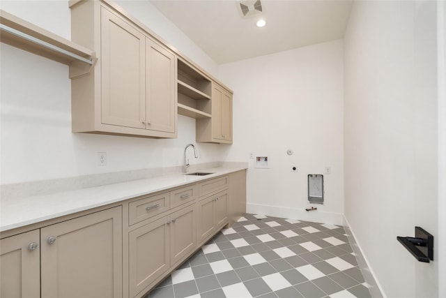 washroom with a sink, cabinet space, gas dryer hookup, visible vents, and washer hookup