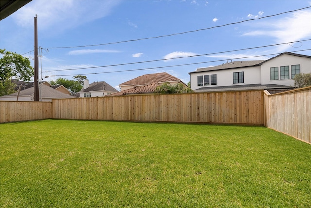view of yard with a fenced backyard
