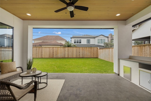 view of patio / terrace with a fenced backyard and a ceiling fan