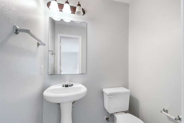 8027 Lavage Ln, Baytown, TX 77521 - bathroom with toilet and a sink