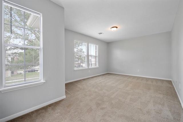 8027 Lavage Ln, Baytown, TX 77521 - spare room with visible vents, baseboards, and carpet flooring