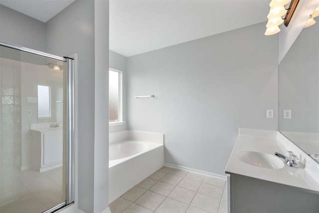8027 Lavage Ln, Baytown, TX 77521 - bathroom featuring baseboards, tile patterned flooring, a shower stall, a garden tub, and vanity