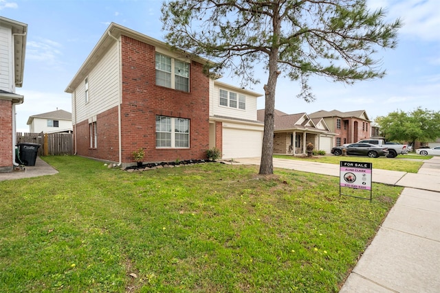 8027 Lavage Ln, Baytown, TX 77521 - traditional-style house with brick siding, a garage, concrete driveway, and fence