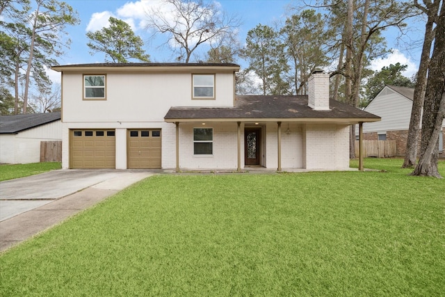 traditional-style home featuring a front lawn, driveway, a chimney, fence, and an attached garage