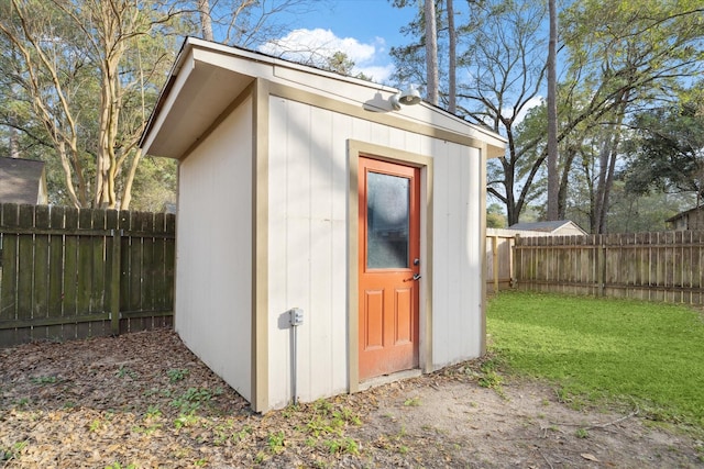 view of shed with a fenced backyard
