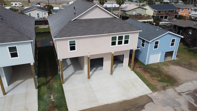 birds eye view of property with a residential view