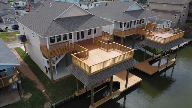 drone / aerial view featuring a water view and a residential view