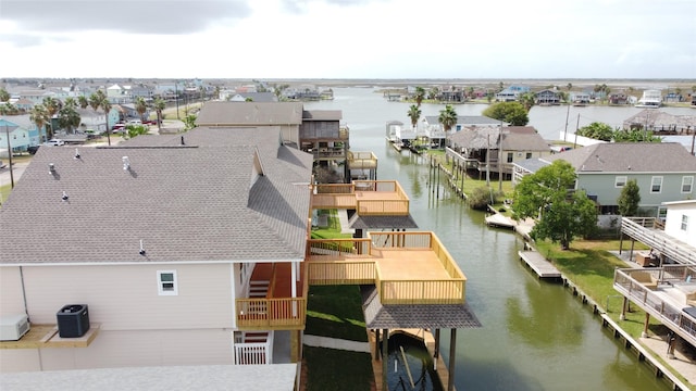 bird's eye view featuring a water view and a residential view