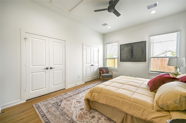 4009 New Orleans St A/B, Unit A/B Houston, TX 77020 - bedroom with wood finished floors, attic access, multiple closets, and visible vents