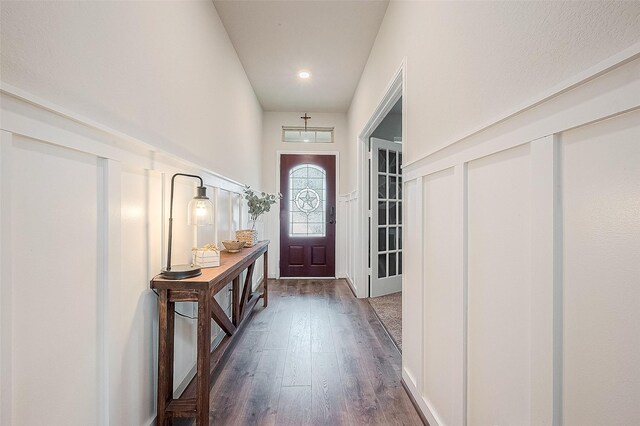 doorway with dark wood-style floors and recessed lighting