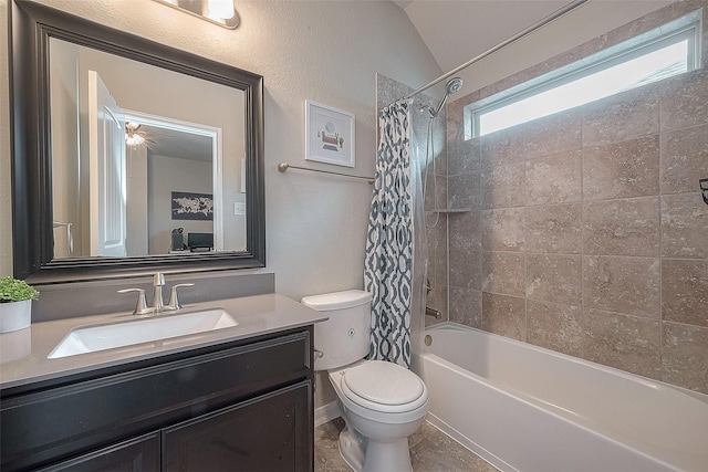 full bath featuring lofted ceiling, shower / tub combo with curtain, vanity, and toilet