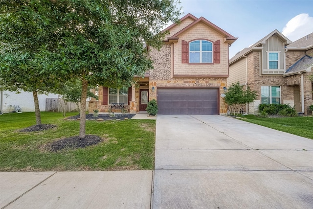 view of front of property with an attached garage, stone siding, a front yard, and driveway