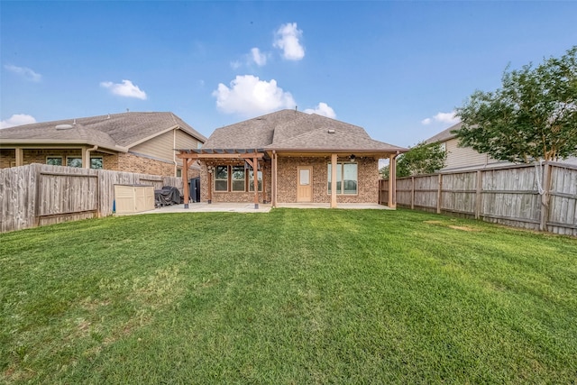 back of property featuring a fenced backyard, a pergola, a lawn, and a patio