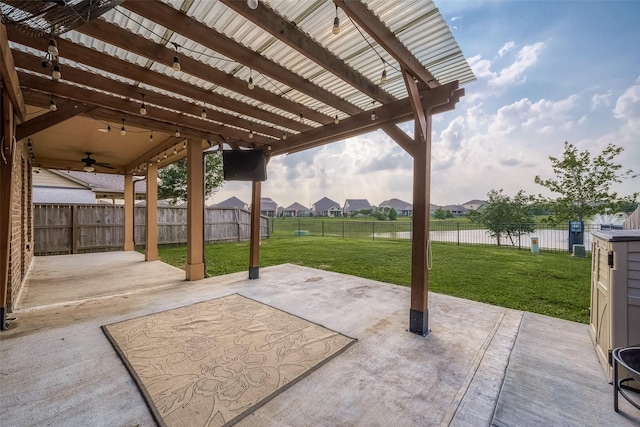 view of patio with a residential view, a ceiling fan, and a fenced backyard
