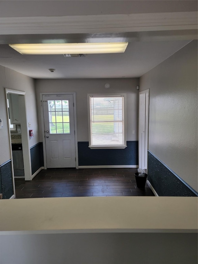entryway featuring wood finish floors and baseboards