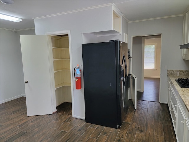 kitchen with white cabinets, crown molding, dark wood-style flooring, and black appliances