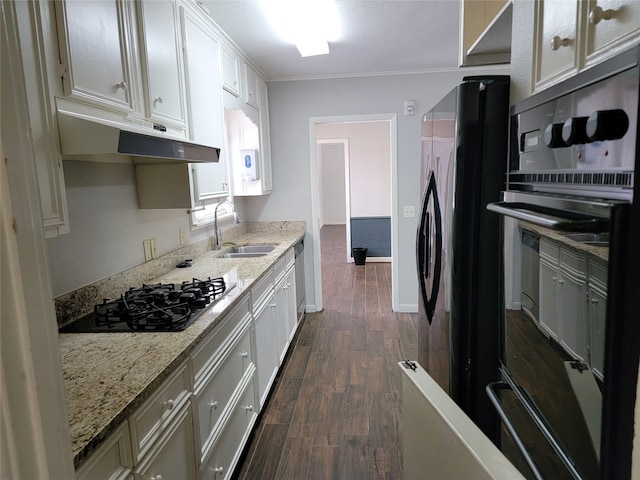 kitchen with white cabinets, a sink, dark wood-style flooring, under cabinet range hood, and black appliances
