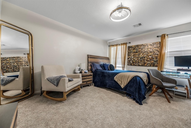 carpeted bedroom with visible vents