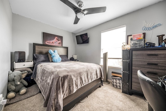 bedroom with ceiling fan and light colored carpet