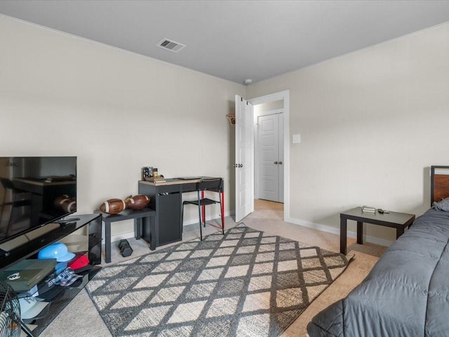 living area with baseboards, visible vents, and light colored carpet