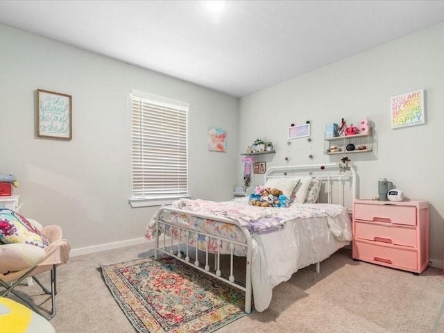 carpeted bedroom with baseboards