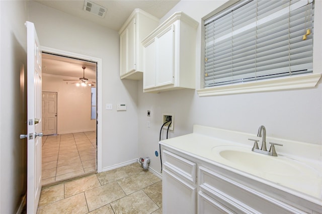 bathroom with visible vents, vanity, baseboards, and ceiling fan