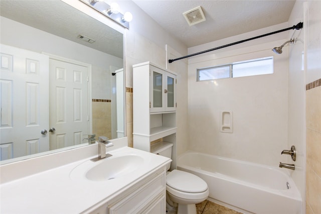 bathroom featuring vanity, toilet, shower / washtub combination, and visible vents