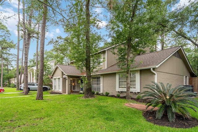 6226 Allentown Dr, Spring, TX 77389 - view of front facade with brick siding, roof with shingles, and a front yard