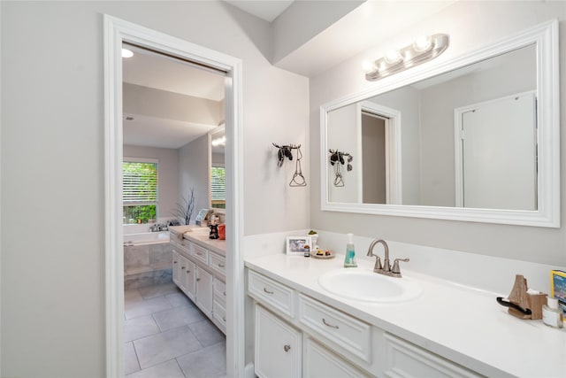 6226 Allentown Dr, Spring, TX 77389 - bathroom featuring a garden tub, tile patterned flooring, and vanity