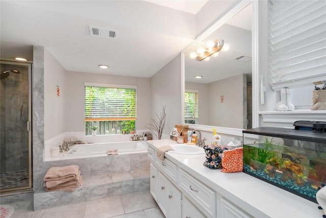 6226 Allentown Dr, Spring, TX 77389 - full bath featuring visible vents, a shower stall, tile patterned flooring, a garden tub, and vanity
