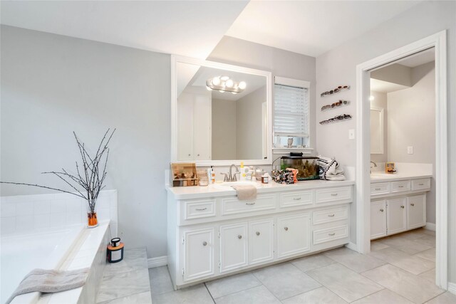 6226 Allentown Dr, Spring, TX 77389 - bathroom featuring vanity, a garden tub, baseboards, and tile patterned flooring