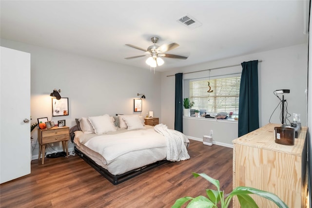 6226 Allentown Dr, Spring, TX 77389 - bedroom featuring dark wood finished floors, visible vents, baseboards, and ceiling fan