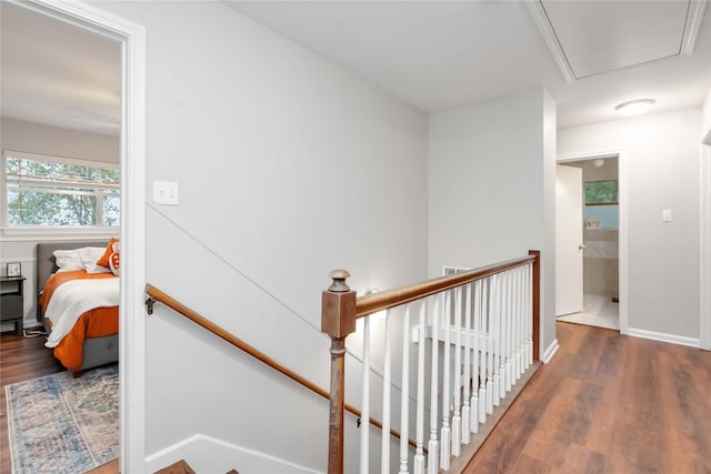 6226 Allentown Dr, Spring, TX 77389 - corridor featuring attic access, wood finished floors, an upstairs landing, and baseboards
