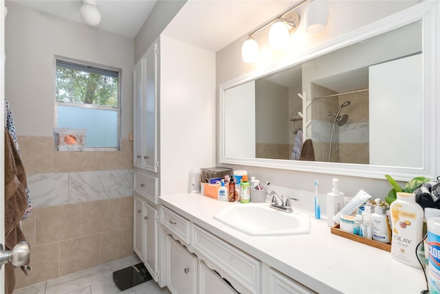 6226 Allentown Dr, Spring, TX 77389 - full bath featuring a tile shower, marble finish floor, and vanity