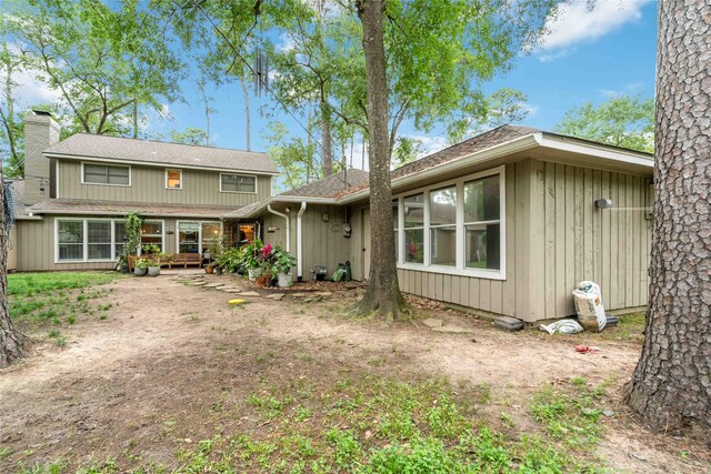 6226 Allentown Dr, Spring, TX 77389 - view of front of home with a shingled roof and a chimney