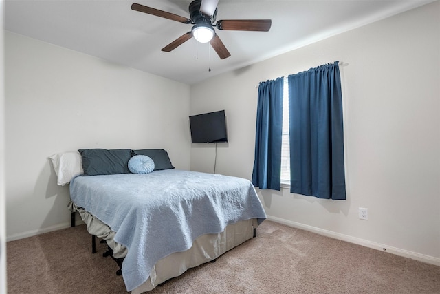 bedroom with carpet flooring, baseboards, and ceiling fan